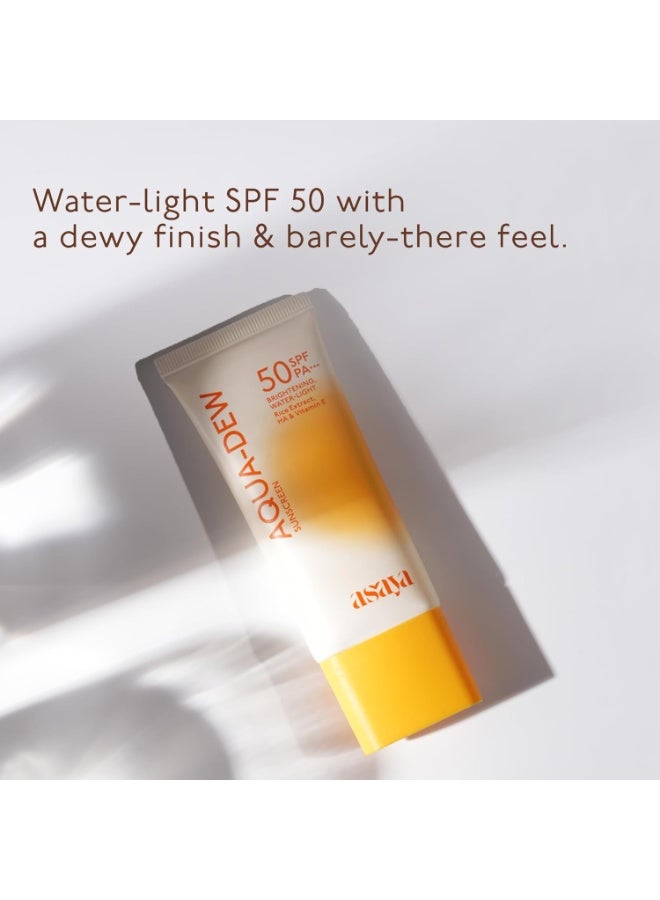Asaya واقي الشمس أسيا أكوا ديو بعامل حماية SPF 50 PA+++ | تم اختباره مخبريًا | حماية من أشعة UVA/UVB | حماية من الضوء الأزرق | يمنح البشرة مظهرًا نديًا | غني بخلاصة الأرز | لا يترك أثرًا أبيض | يمنع اسمرار البشرة | واقي شمس مائي خفيف للغاية | مقاوم للماء والعرق | خالٍ من العطور | لبشرة موحدة اللون ومتألقة | مناسب للرجال والنساء | لجميع أنواع البشرة: الدهنية والجافة والحساسة | 50 مل - Image 1